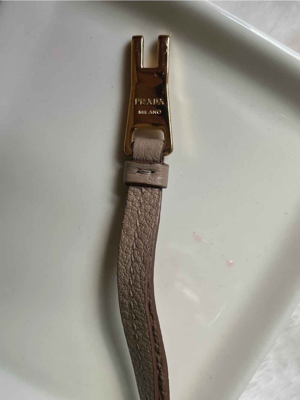 Prada Gold Hardware with Brown Leather Strap and black ribbon